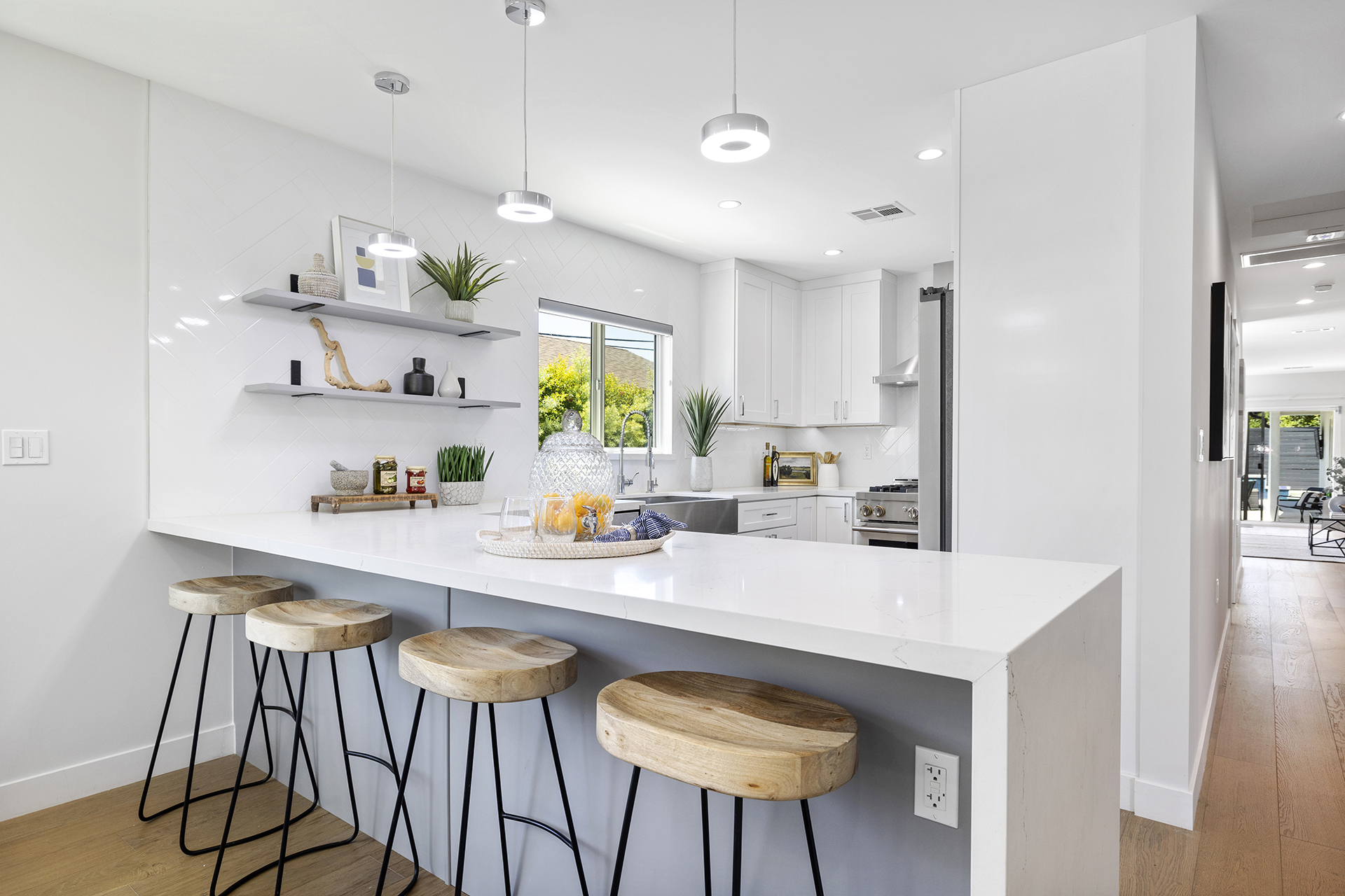 Staged kitchen with white bar counter — home staging