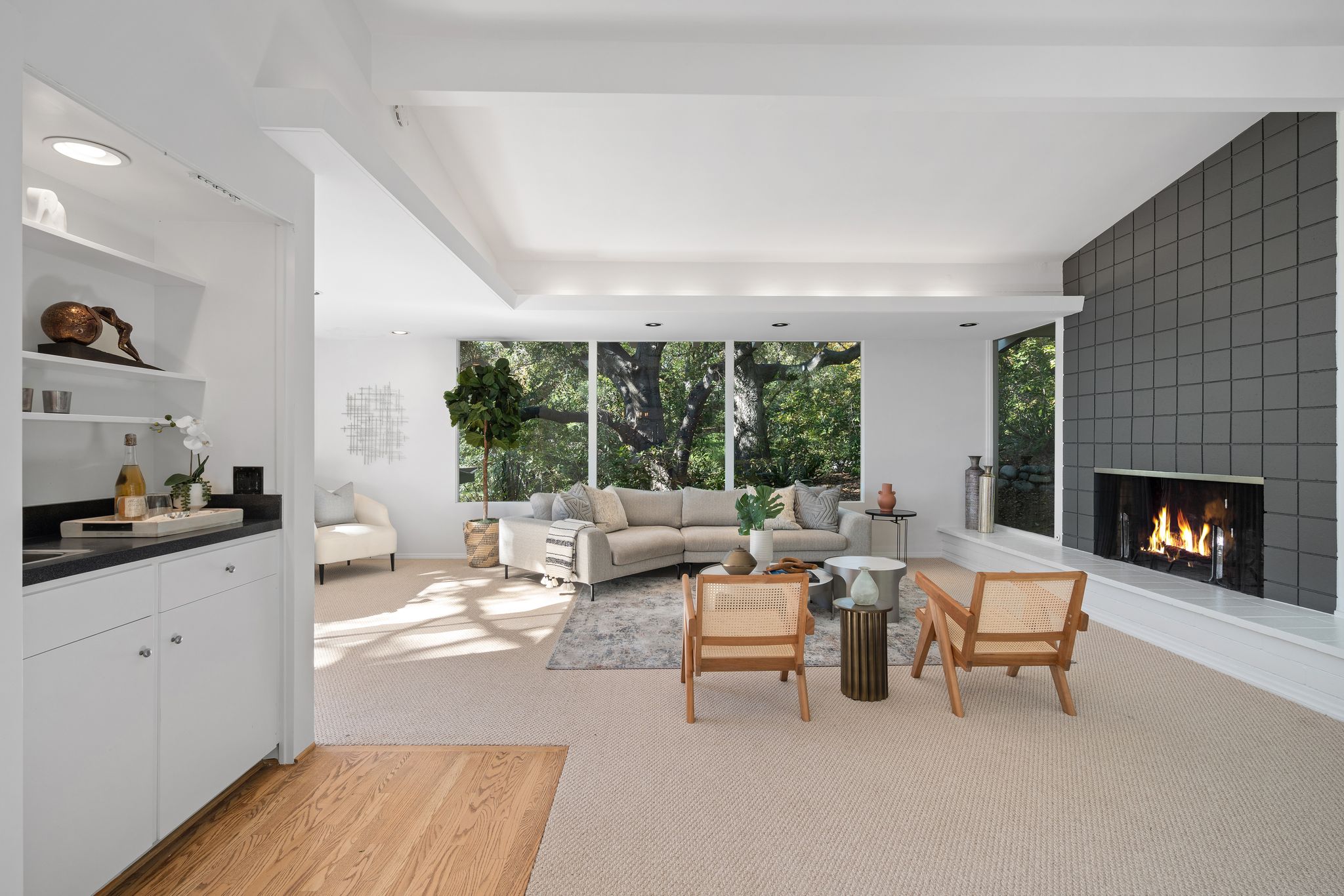 Wide-angle staged midcentury living room — vacant property home staging