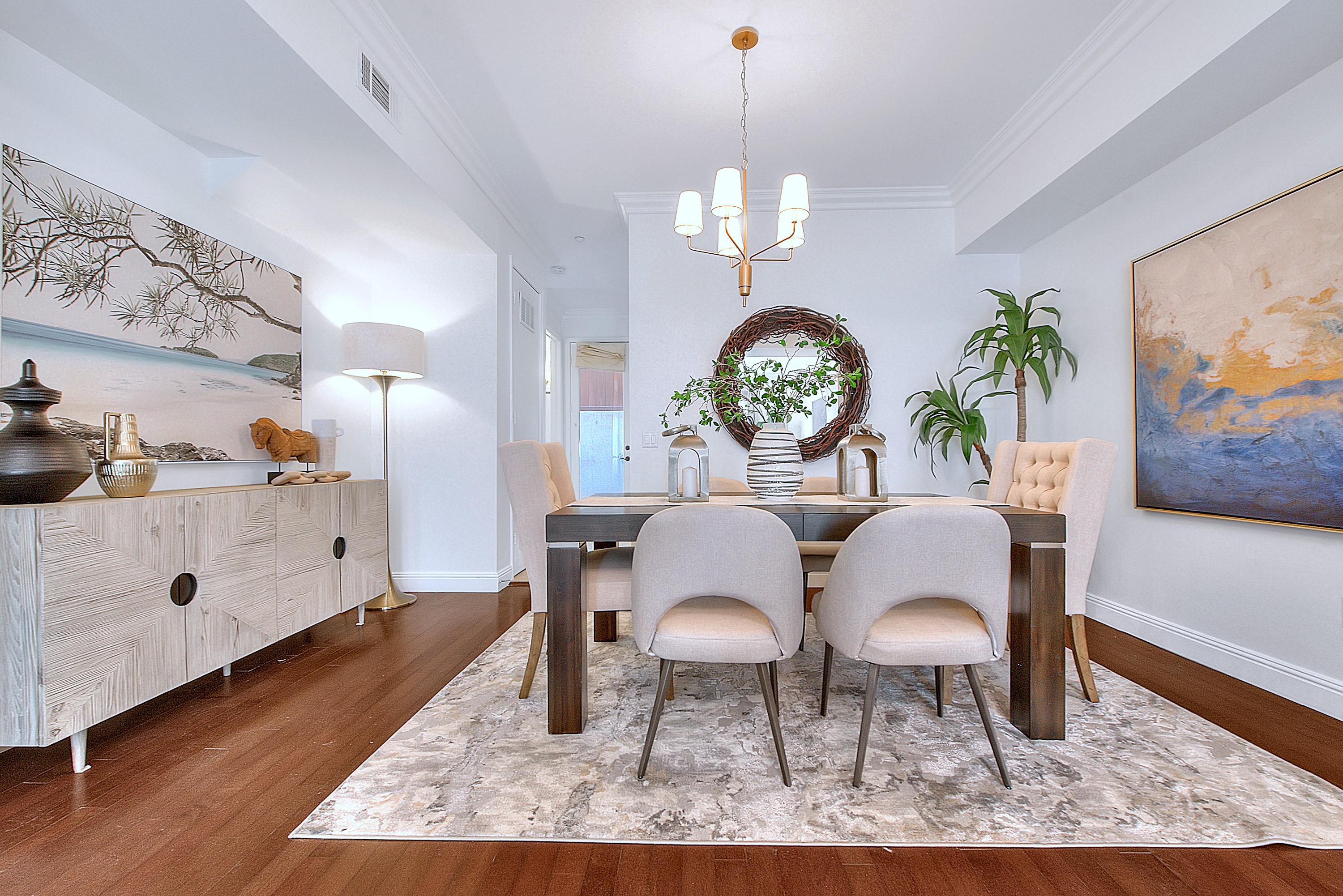 Staged dining room with statement chandelier — home staging
